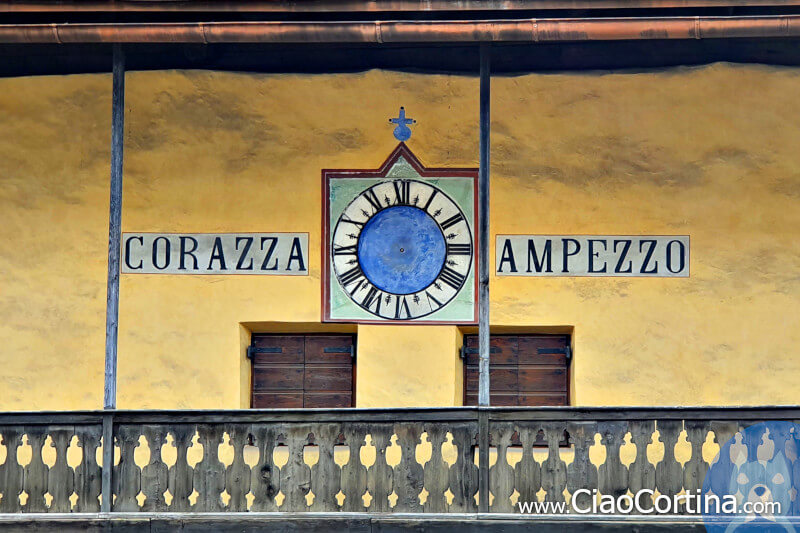 A detail of the clock of Casa Corazza in Cortina