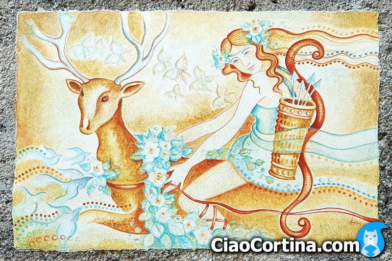 Un murales molto suggestivo con un cervo cavalcato da una ragazza