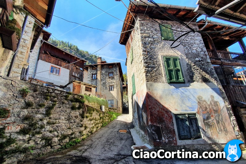 Very suggestive foreshortening ok Cibiana di Cadore with stone walls houses