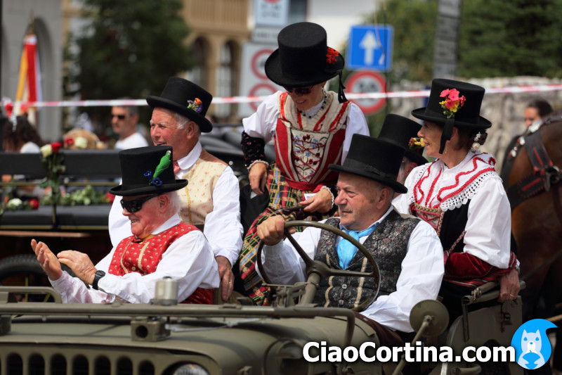 Volunteers in Ampezzo dress in Jeep parade
