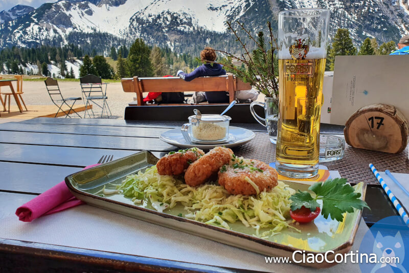 A plate of dumplings with a beer at the lodge